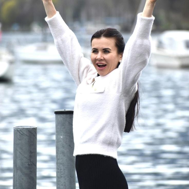 Kaveri Mehta, Lead Design Curator at AnchorBridgeField, reviewing corporate floral arrangements